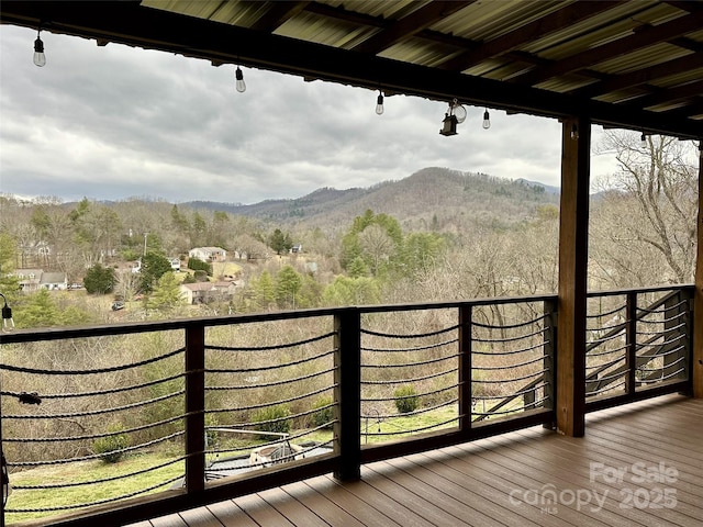 balcony with a mountain view and a forest view