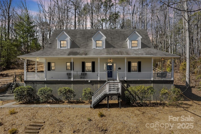 view of front of property with covered porch and stairs