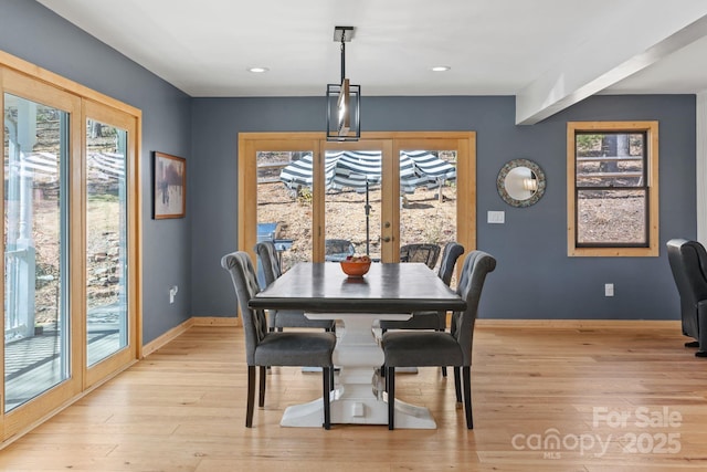 dining space featuring french doors, light wood-type flooring, recessed lighting, and baseboards