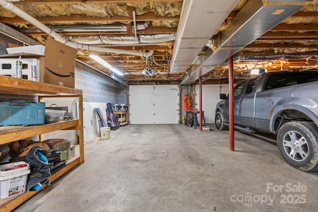 garage with concrete block wall