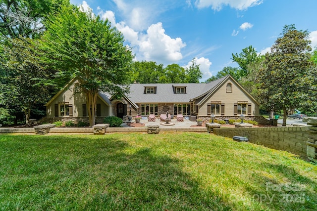 back of house featuring a yard and a patio