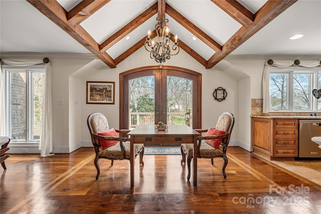 dining area featuring lofted ceiling with beams, light wood-style floors, baseboards, and french doors