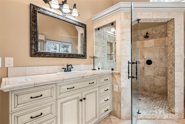 bathroom featuring a stall shower, tile patterned flooring, and vanity