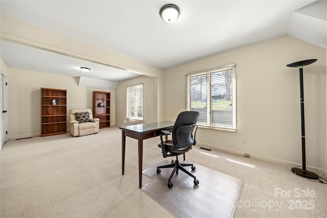 home office featuring vaulted ceiling, carpet, and baseboards