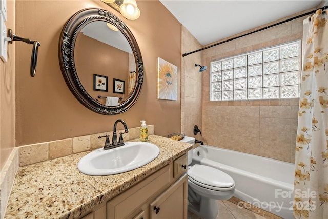 bathroom featuring shower / bath combo, vanity, toilet, and tile patterned floors