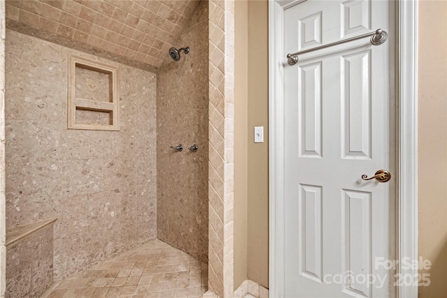 full bath with tiled shower