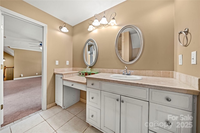 bathroom featuring a ceiling fan, tile patterned flooring, vanity, and baseboards