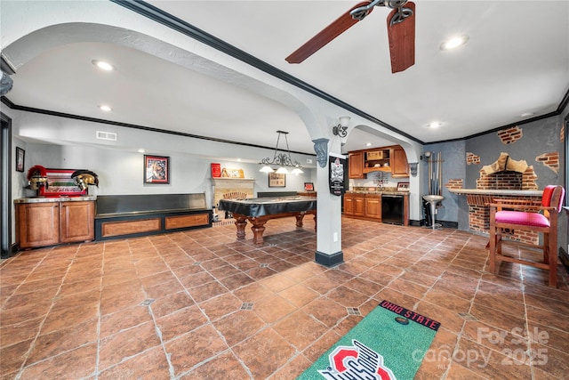 game room featuring recessed lighting, bar, crown molding, and visible vents