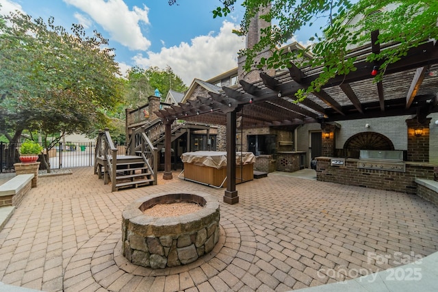 view of patio / terrace featuring fence, a hot tub, area for grilling, and a pergola