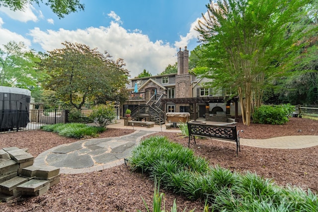 surrounding community with a patio area and fence