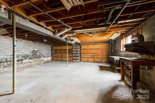 garage with concrete block wall