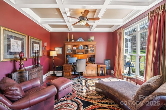 office area with coffered ceiling, wood finished floors, a ceiling fan, baseboards, and beamed ceiling