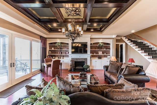 living room with a fireplace with flush hearth, french doors, dark wood-type flooring, and stairway