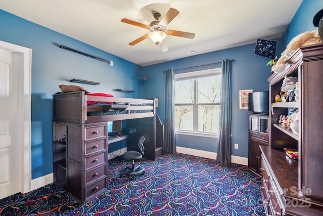 bedroom featuring a ceiling fan and baseboards