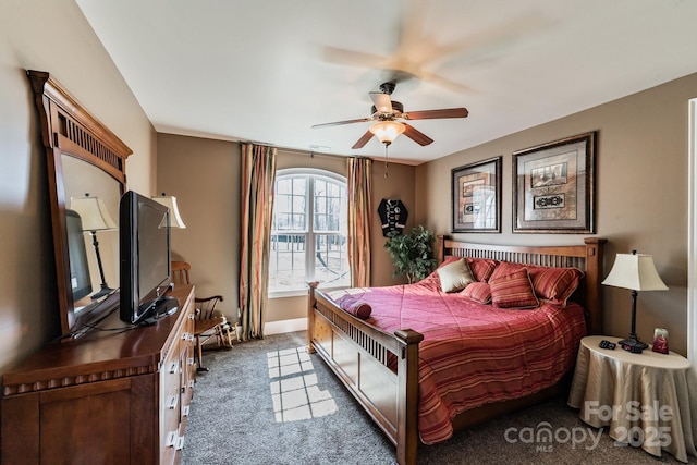 bedroom with carpet, ceiling fan, and baseboards