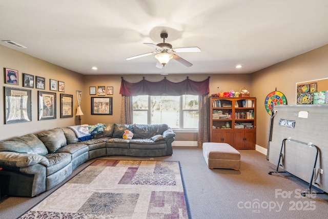 carpeted living room with ceiling fan, visible vents, baseboards, and recessed lighting