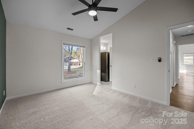 unfurnished bedroom featuring a ceiling fan, baseboards, visible vents, and carpet flooring