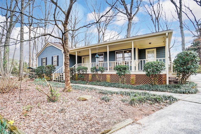 ranch-style house with covered porch