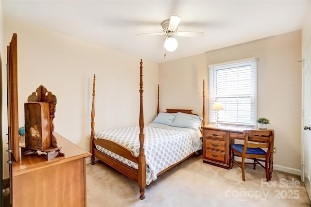 bedroom featuring light carpet and ceiling fan