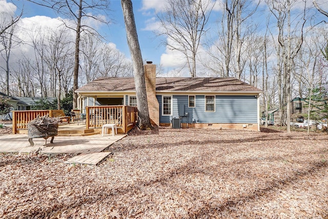 rear view of house featuring crawl space, central AC, a chimney, and a wooden deck