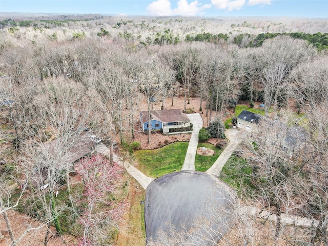 drone / aerial view with a view of trees