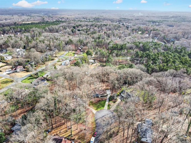 bird's eye view featuring a forest view