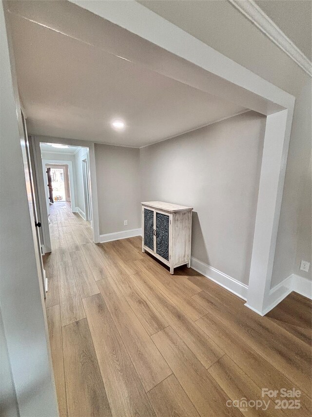 interior space featuring light wood-style floors and baseboards