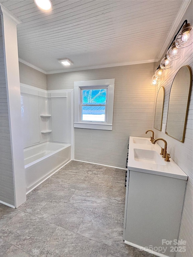 bathroom featuring shower / bathtub combination, double vanity, a sink, and crown molding