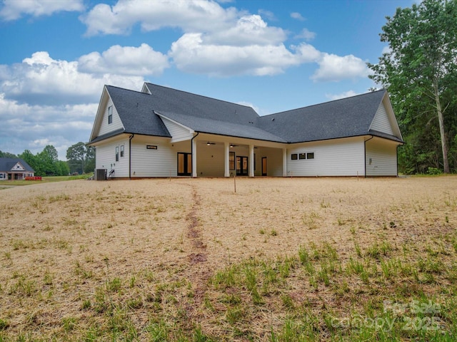 view of front of home featuring a ceiling fan and central AC unit