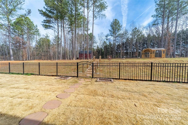 view of yard featuring a gate and fence