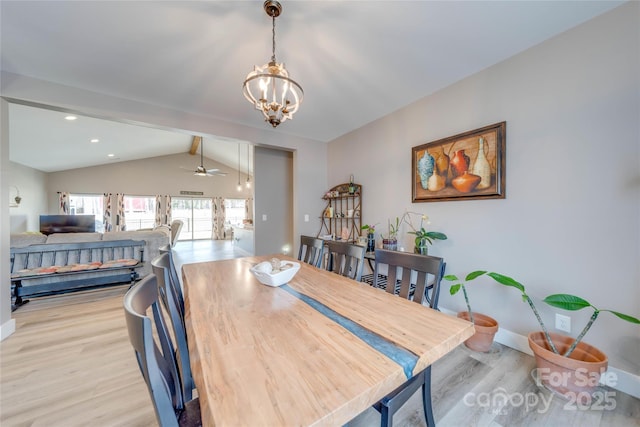 dining space with recessed lighting, baseboards, lofted ceiling with beams, light wood-style floors, and ceiling fan with notable chandelier