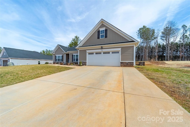 craftsman house featuring a garage, concrete driveway, stone siding, a front lawn, and board and batten siding