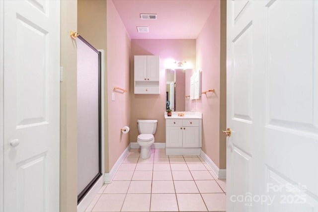 bathroom with toilet, visible vents, vanity, a shower stall, and tile patterned floors