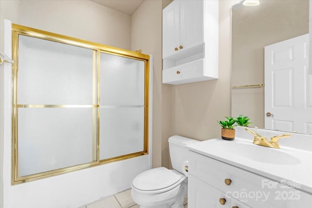 bathroom with toilet, enclosed tub / shower combo, and vanity