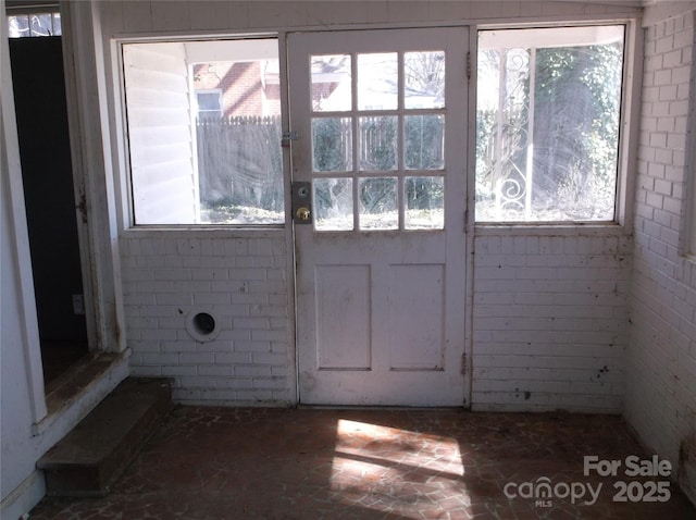 doorway to outside with a wealth of natural light