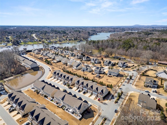 aerial view featuring a residential view and a water view