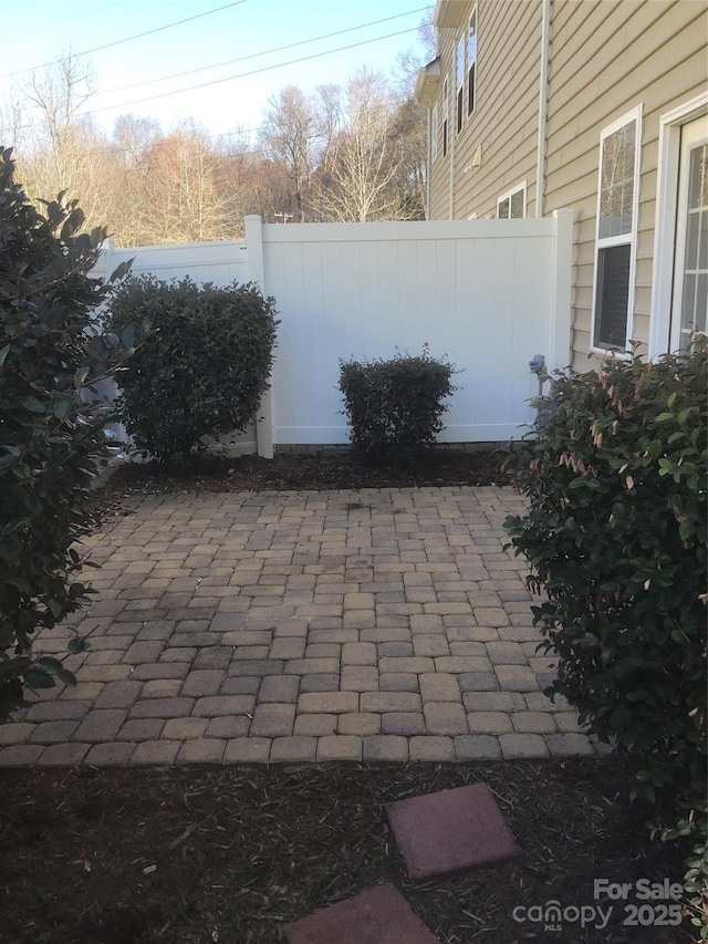 view of patio featuring fence