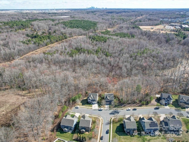 drone / aerial view with a view of trees