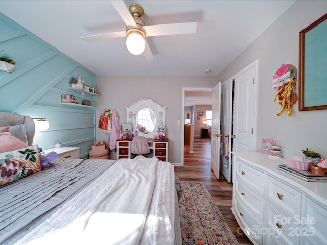 bedroom featuring dark wood-style floors and ceiling fan