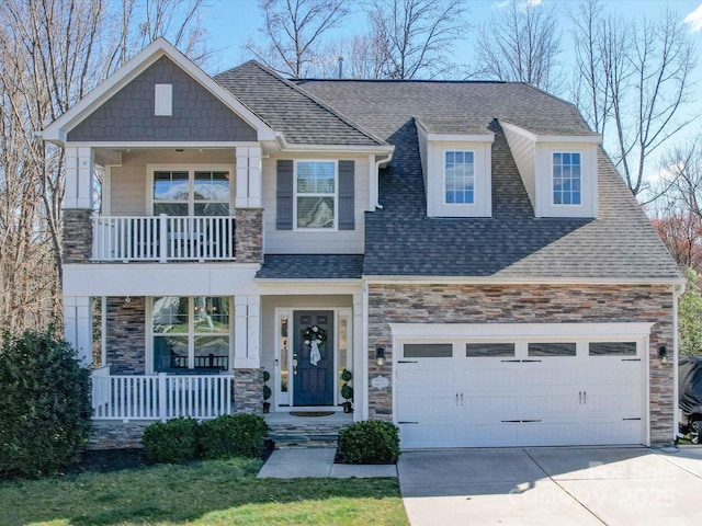 craftsman house featuring a porch, stone siding, and roof with shingles