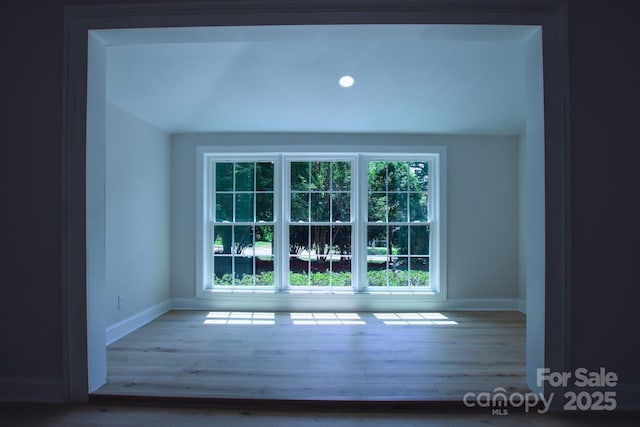 interior details with wood finished floors and baseboards