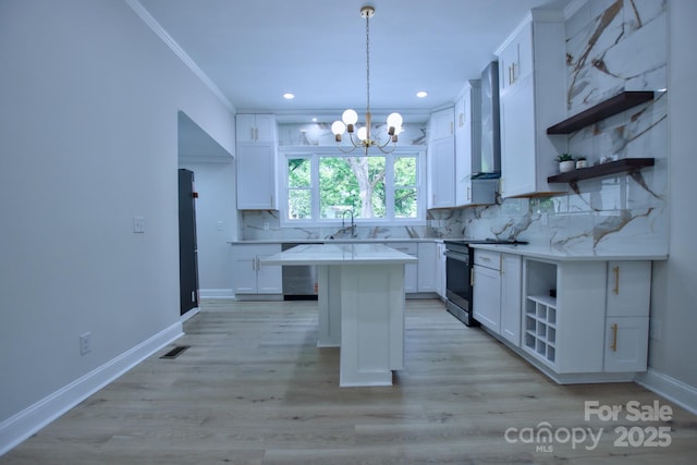 kitchen featuring stainless steel appliances, open shelves, white cabinets, backsplash, and a notable chandelier