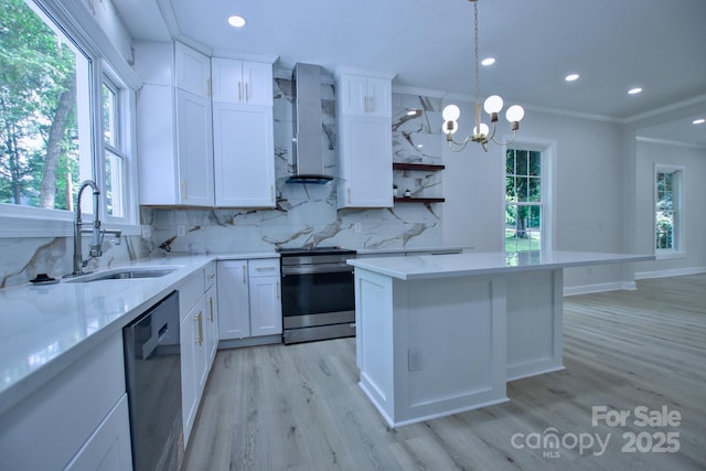 kitchen with a sink, light wood-style floors, stainless steel range with electric cooktop, wall chimney exhaust hood, and dishwasher