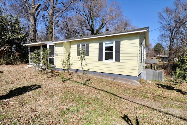 bungalow-style house featuring central air condition unit