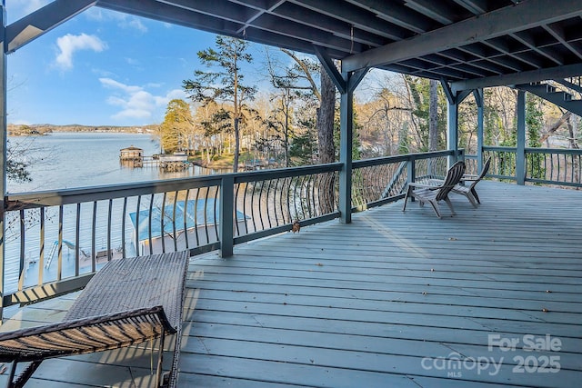 wooden terrace with a water view