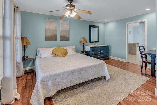 bedroom with crown molding, baseboards, wood finished floors, and recessed lighting