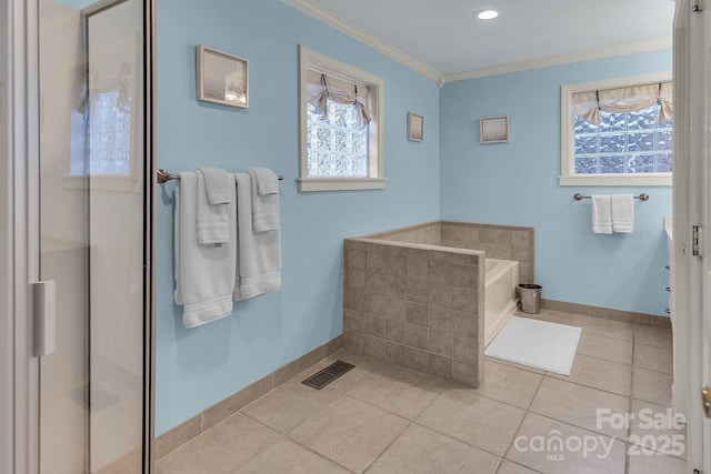 bathroom featuring visible vents, baseboards, ornamental molding, tile patterned flooring, and a bath