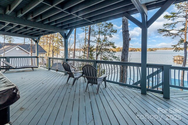 deck featuring a water view