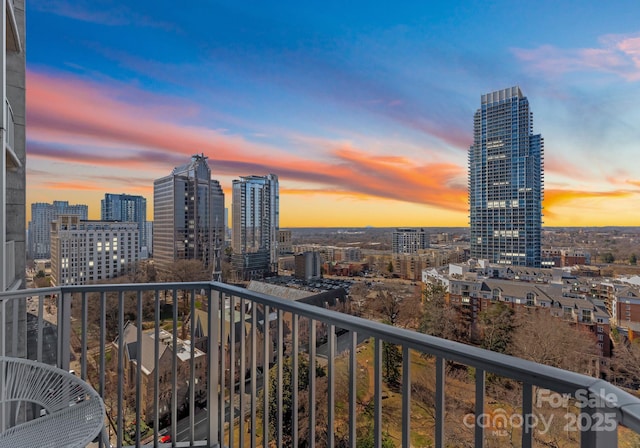 balcony at dusk with a city view