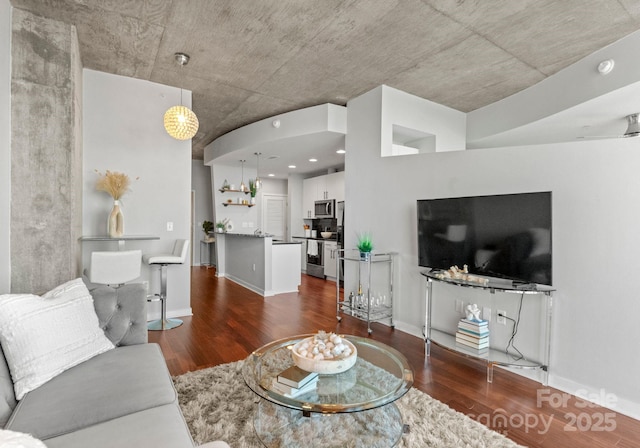 living room with dark wood-style floors and baseboards